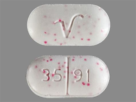 Look at the fonts in the. . Round white pill with red specks no imprint